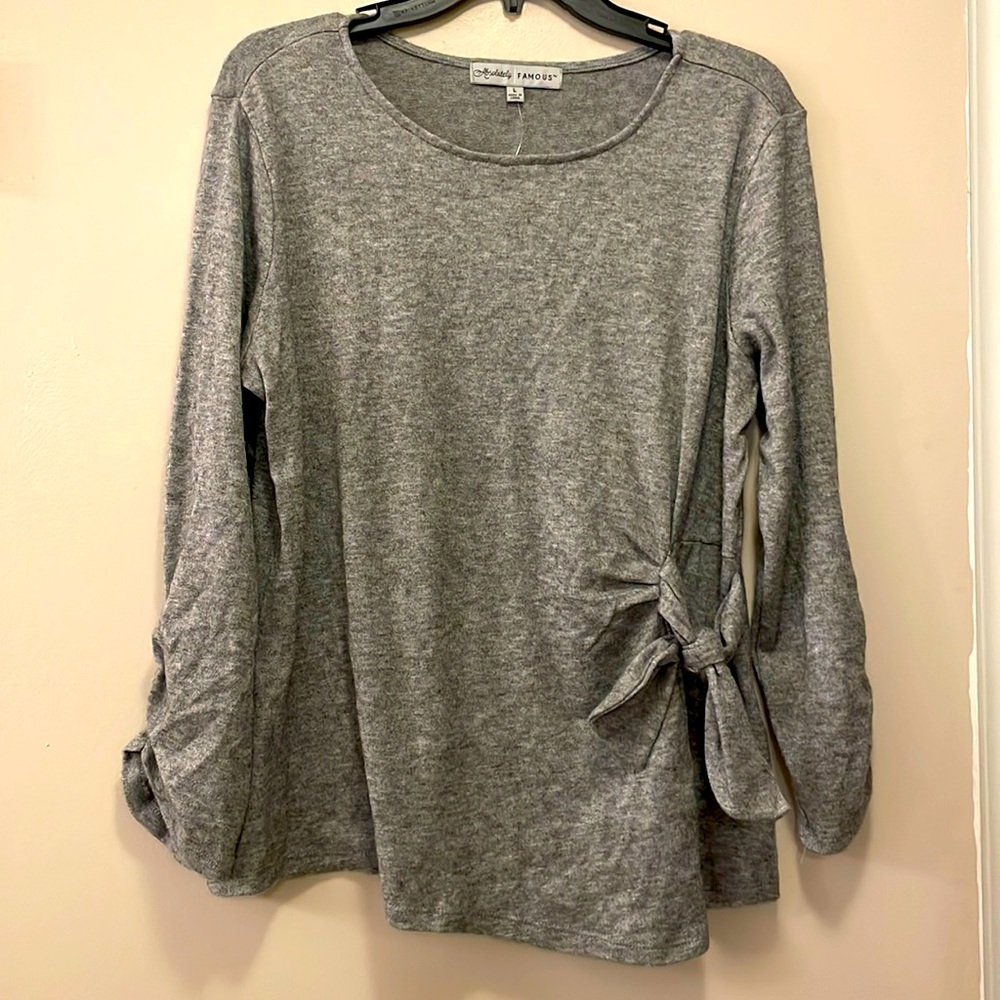 Shirt with 3/4 length sleeves and tie on the side